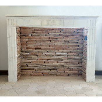 Louis XVI white marble fireplace.