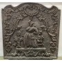 Plaque de fonte dame et chien